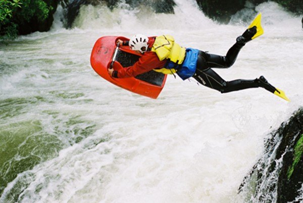 helisledging in New Zealand down a class four waterfall