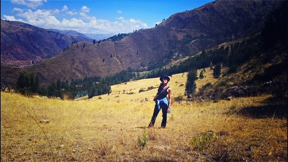 Nora Dunn, The Professional Hobo, in a field in the Andes, on her way up Pachatusan