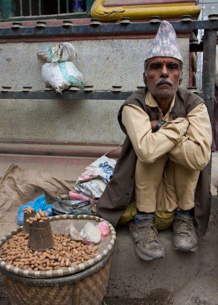 Nepalese man selling peanuts; photo by Ottsworld Sherry Ott