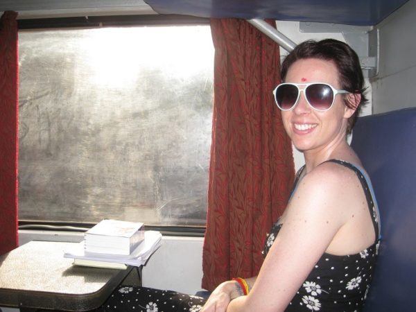 Nicole of Woman Seeks World, sitting on a train in India